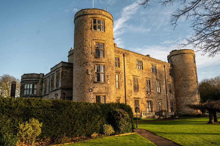 Walworth Castle in County Durham surrounded by historic stone walls and landscaped grounds, a popular fairy-tale wedding venue.
