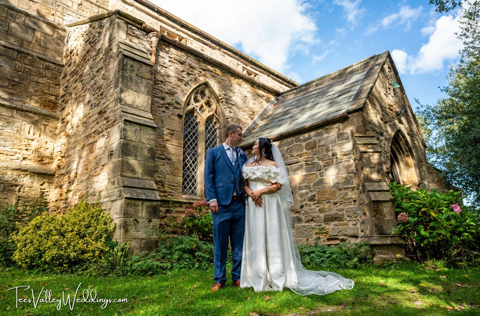 Bride and groom outside the church near Sixty‑One Durham wedding venue in County Durham